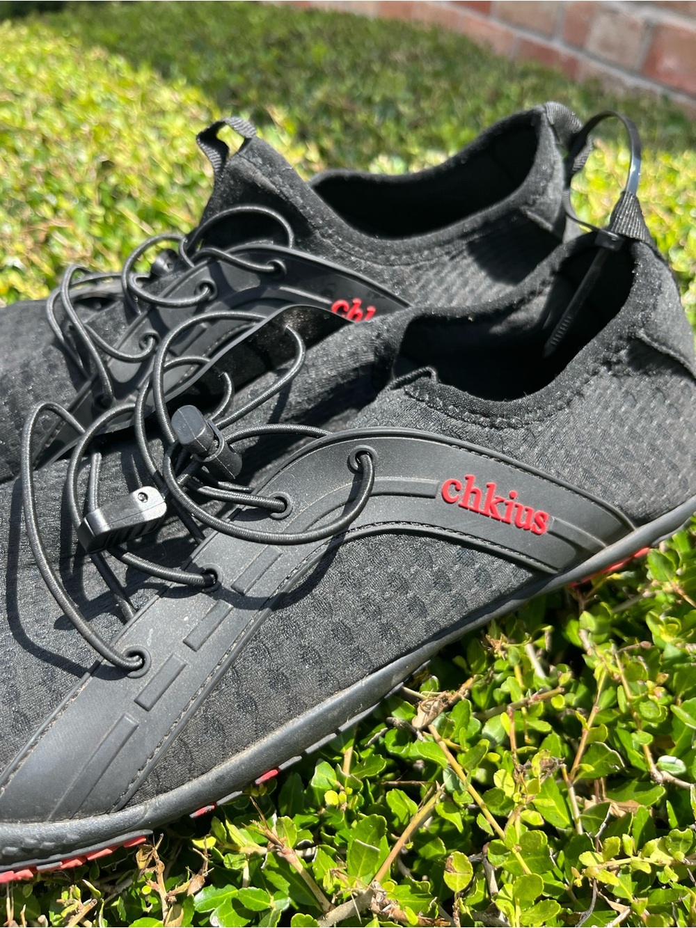 Men's Black Athletic Shoes with Red Accent - Slip-On Performance